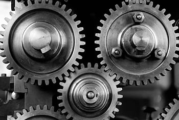 Three silver-black gears are neatly arranged up and down