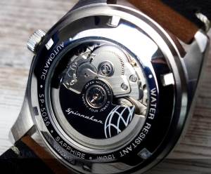 An automatic watch on the wooden table