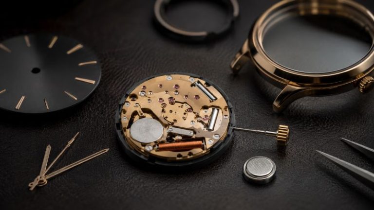 Watch movement components on a surface
