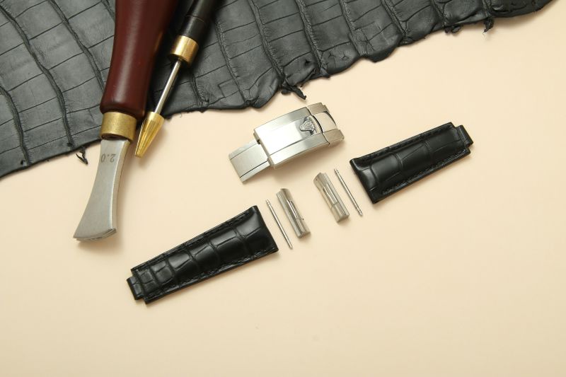 Watch band components on a surface.
