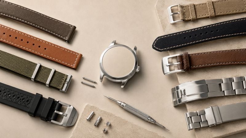 Various watch bands and tools displayed.
